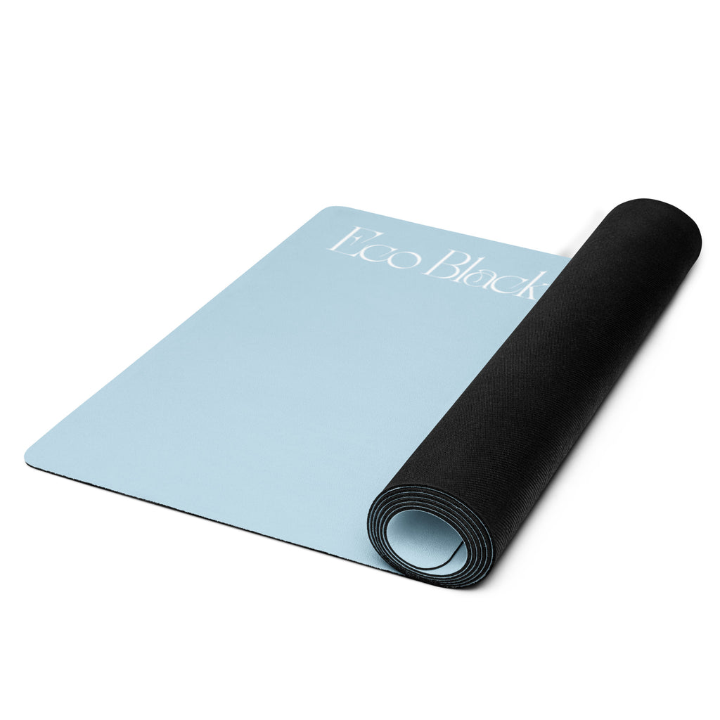 Powder blue yoga mat rolled with black underside showing, EcoBlack logo near center.