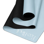Powder blue yoga mat folded, showing black textured grip underside and EcoBlack mark.