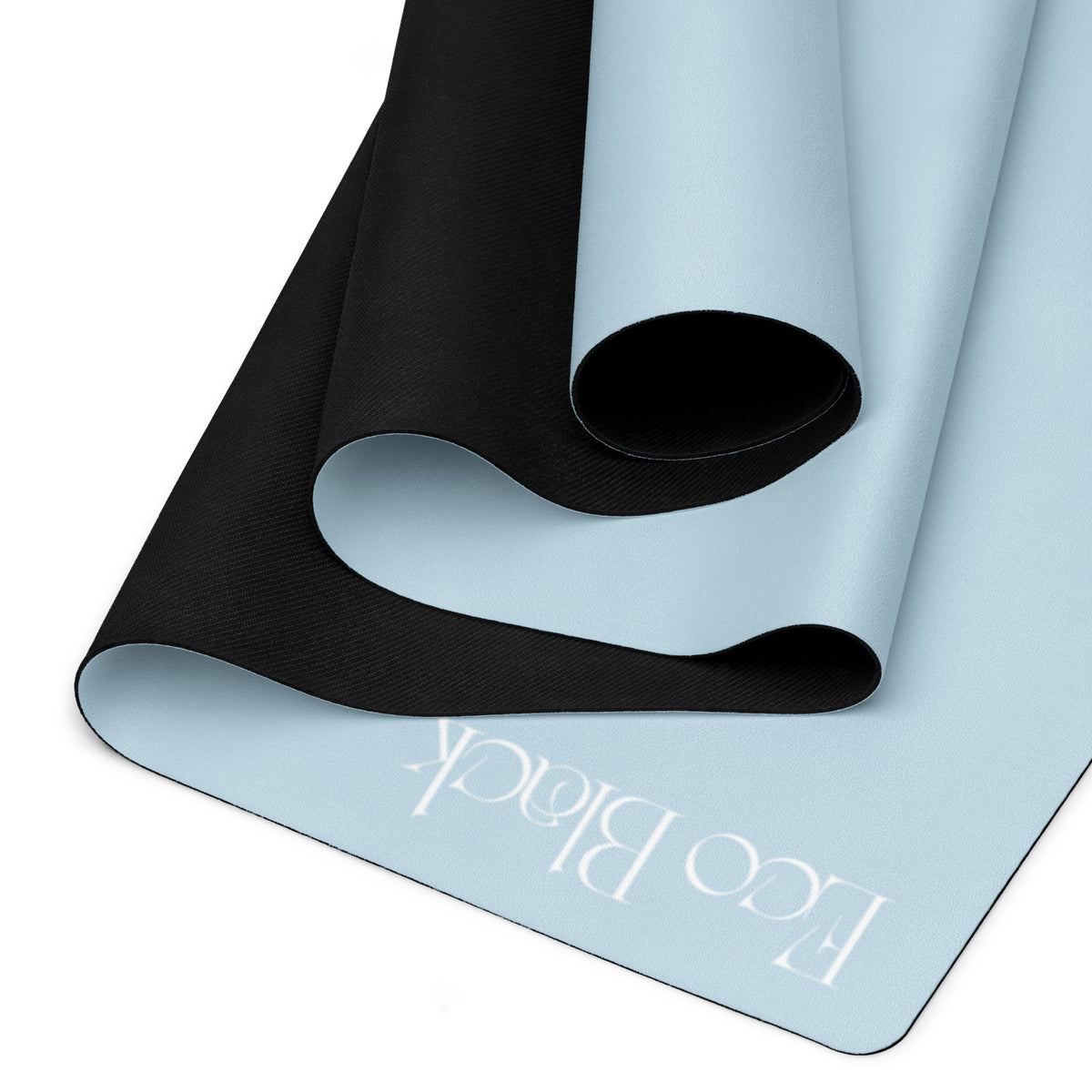 Powder blue yoga mat folded, showing black textured grip underside and EcoBlack mark.