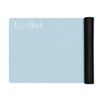Powder blue natural rubber yoga mat with black rolled end and EcoBlack branding.