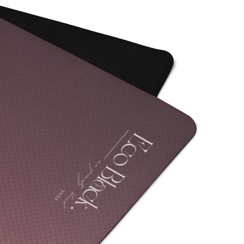 Close-up of mauve yoga mat surface with black textured border
