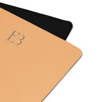 Corner close-up of a golden yoga mat with textured grip and E3 logo