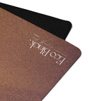 Brown EcoBlack yoga mat with textured surface and corner logo
