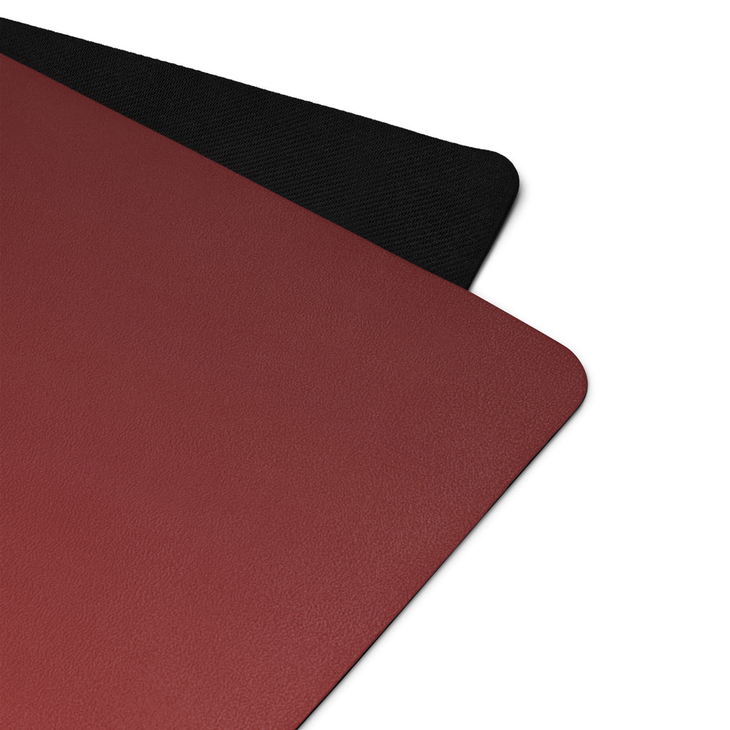 Red yoga mat with black textured edge and grippy surface