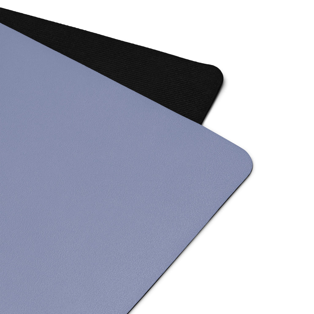 Pale iris natural rubber yoga mat with black textured edge and rounded corner.