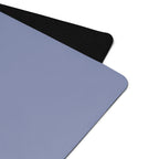 Pale iris natural rubber yoga mat with black textured edge and rounded corner.