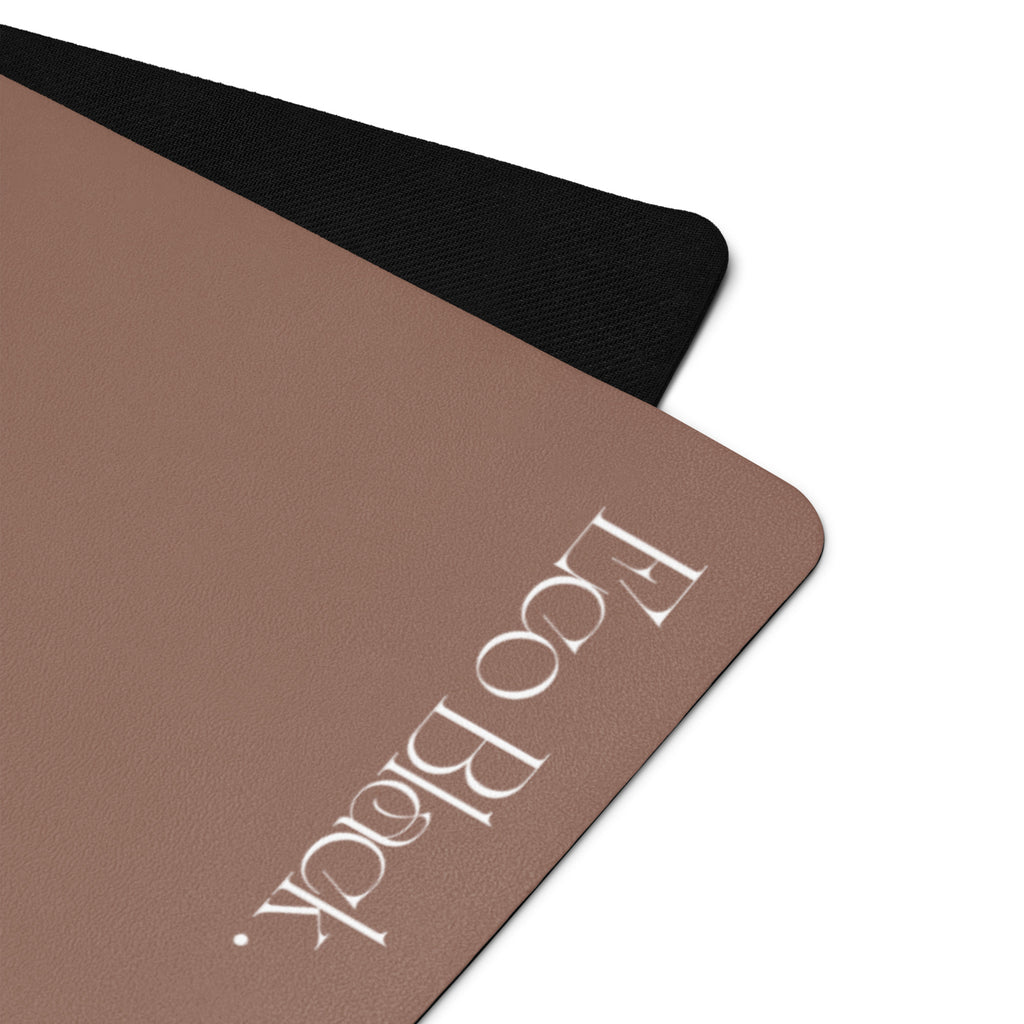 Chocolate yoga mat corner close-up with white "Lopaldia" logo