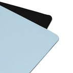 Powder blue yoga mat corner with textured black edge trim.